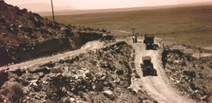 1920s cars climbing switchback roads
