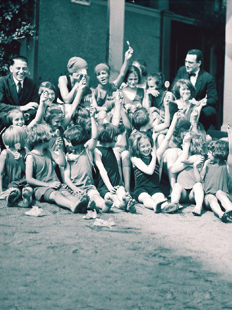 Orphan Girls in Swimsuits with lollipops