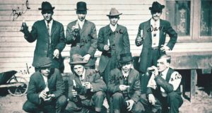 A group of bootleggers pose for a photo