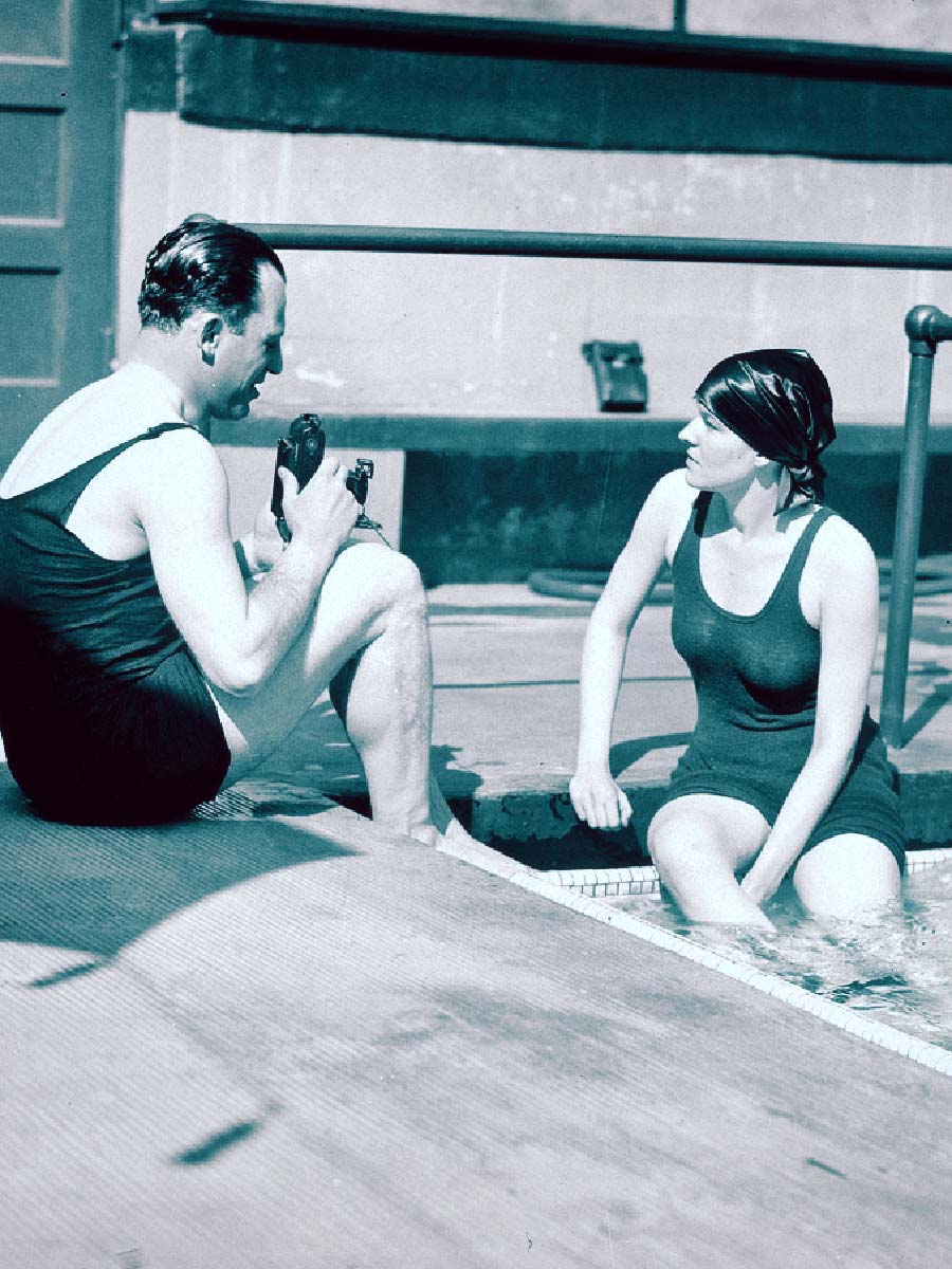 Man and Woman talking in the pool